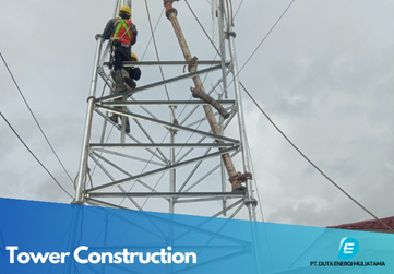 Telecommunications tower in a rural area with mountains in the background