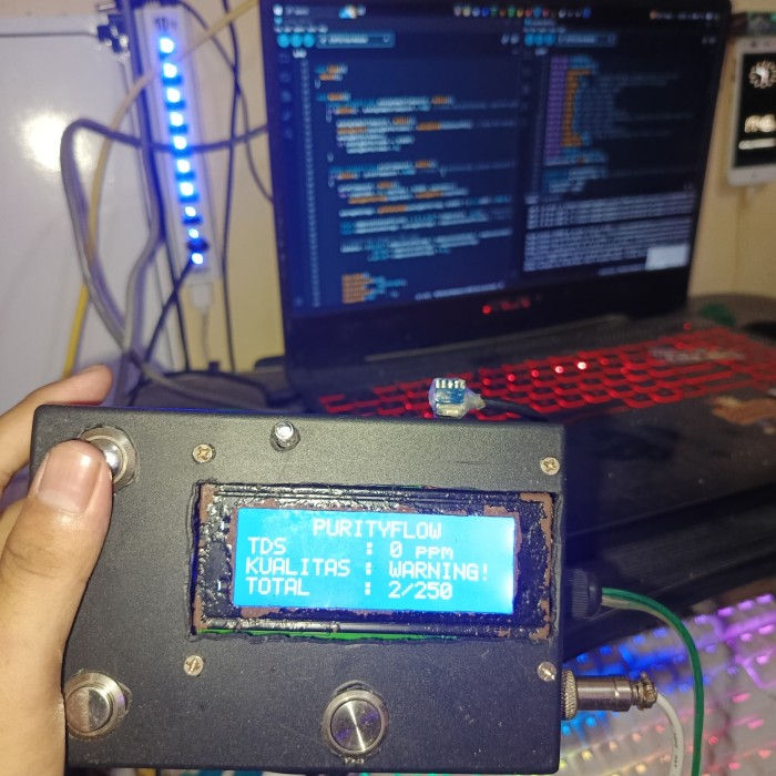 Telecommunications tower in a rural area with mountains in the background