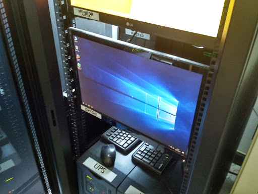 Telecommunications tower with a cloudy sky background